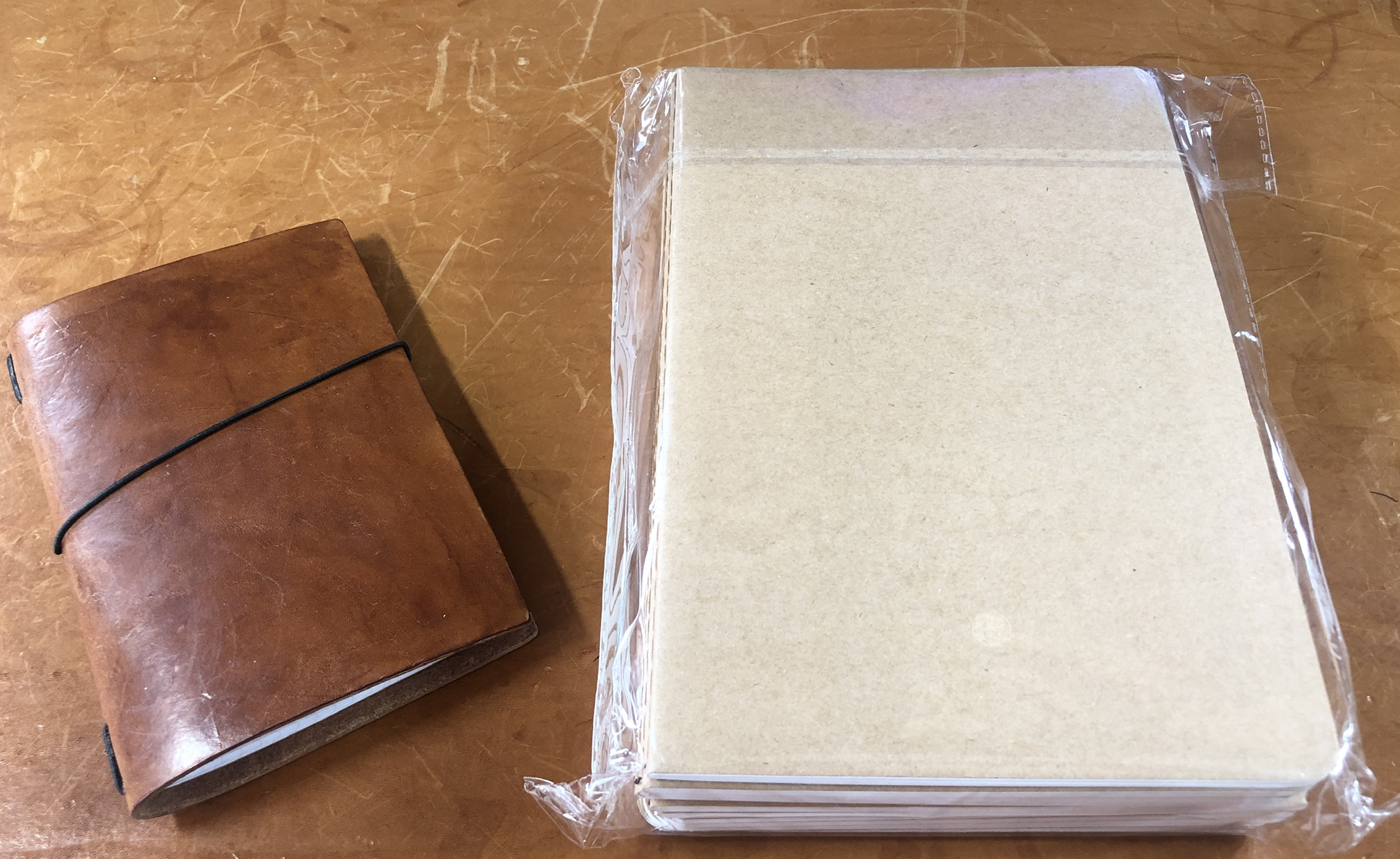 Fieldnotes with leather cover, left. New notebooks, right.